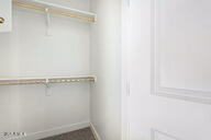 23175 West Skinner Road Wittmann, AZ 85361 - Photo 27 of 35 a view of walk in closet with empty racks