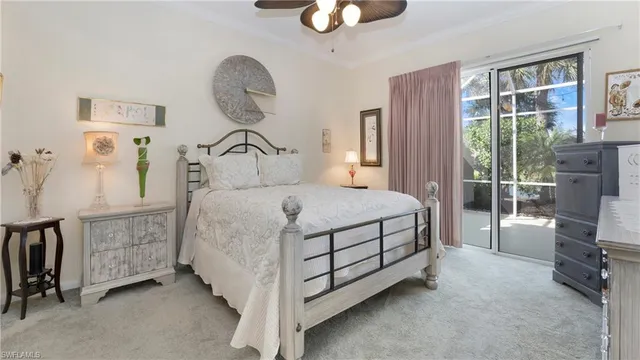 a bedroom with a bed a window and dresser