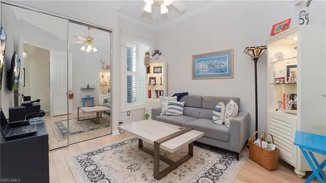 a living room with furniture a rug and a chandelier