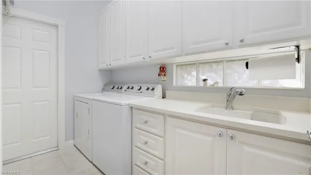 a kitchen with cabinets and window