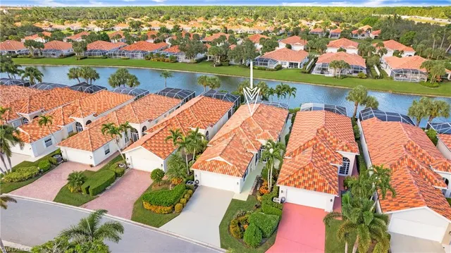 an aerial view of a house with a lake view