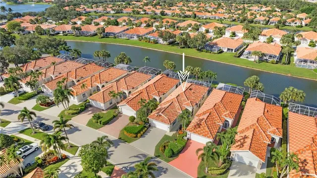 an aerial view of a house with a lake view