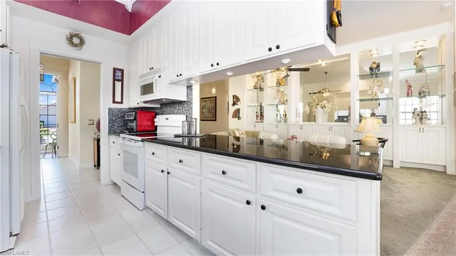 a kitchen with counter top space and cabinets