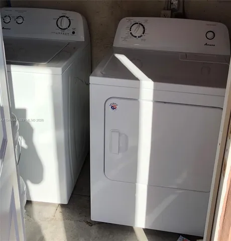 a utility room with dryer and washer