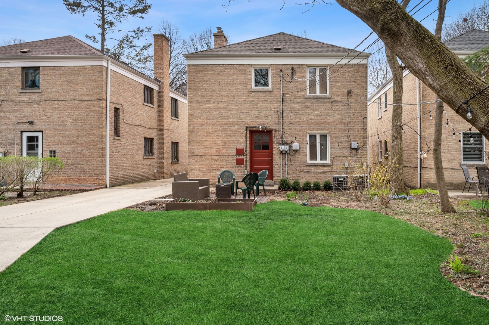 2311 Brown Avenue, Unit 1 Evanston, IL 60201 - Photo 3 of 13 a front view of a house with a yard