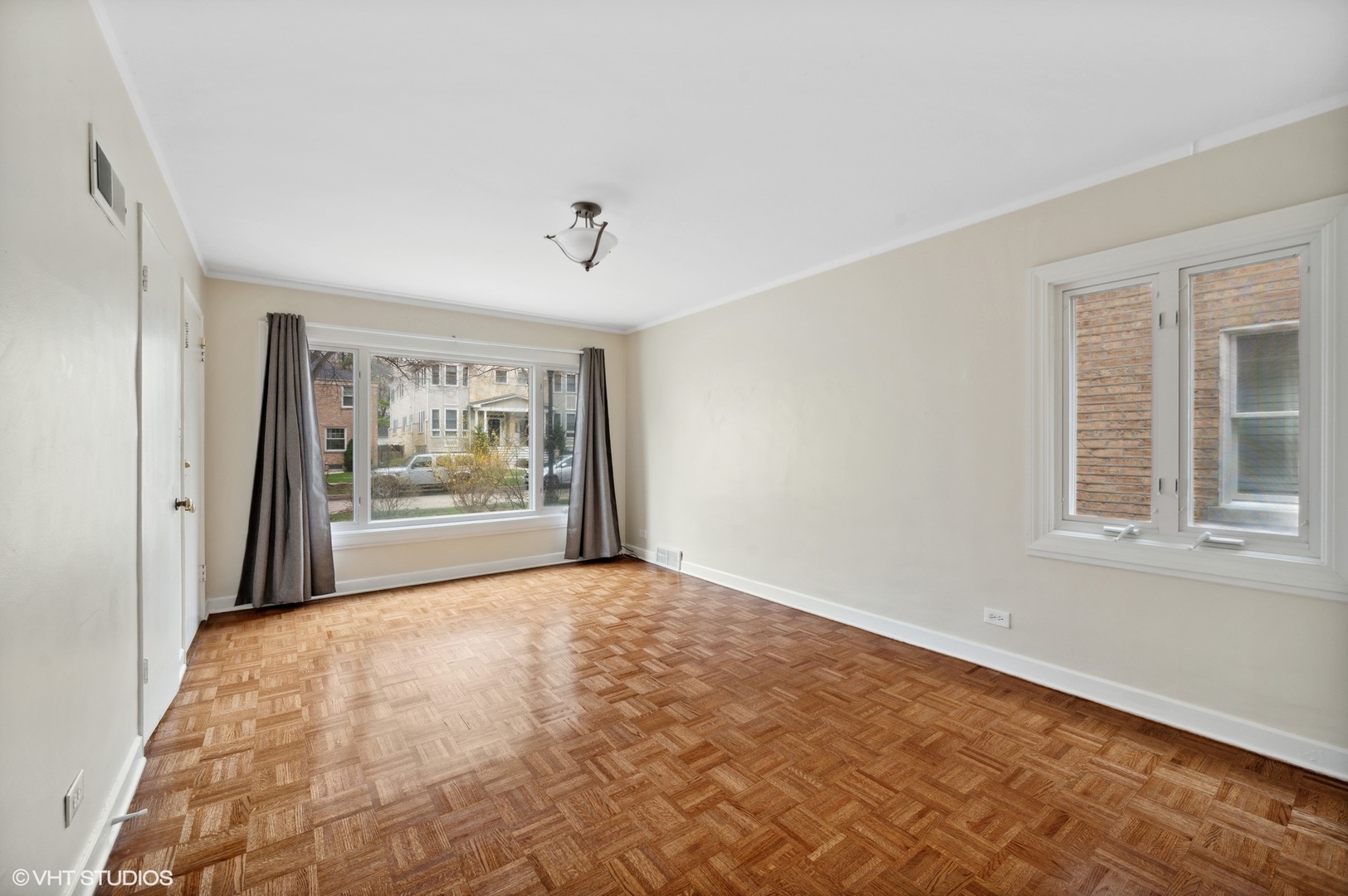 2311 Brown Avenue, Unit 1 Evanston, IL 60201 - Photo 8 of 13 a view of an empty room with a window