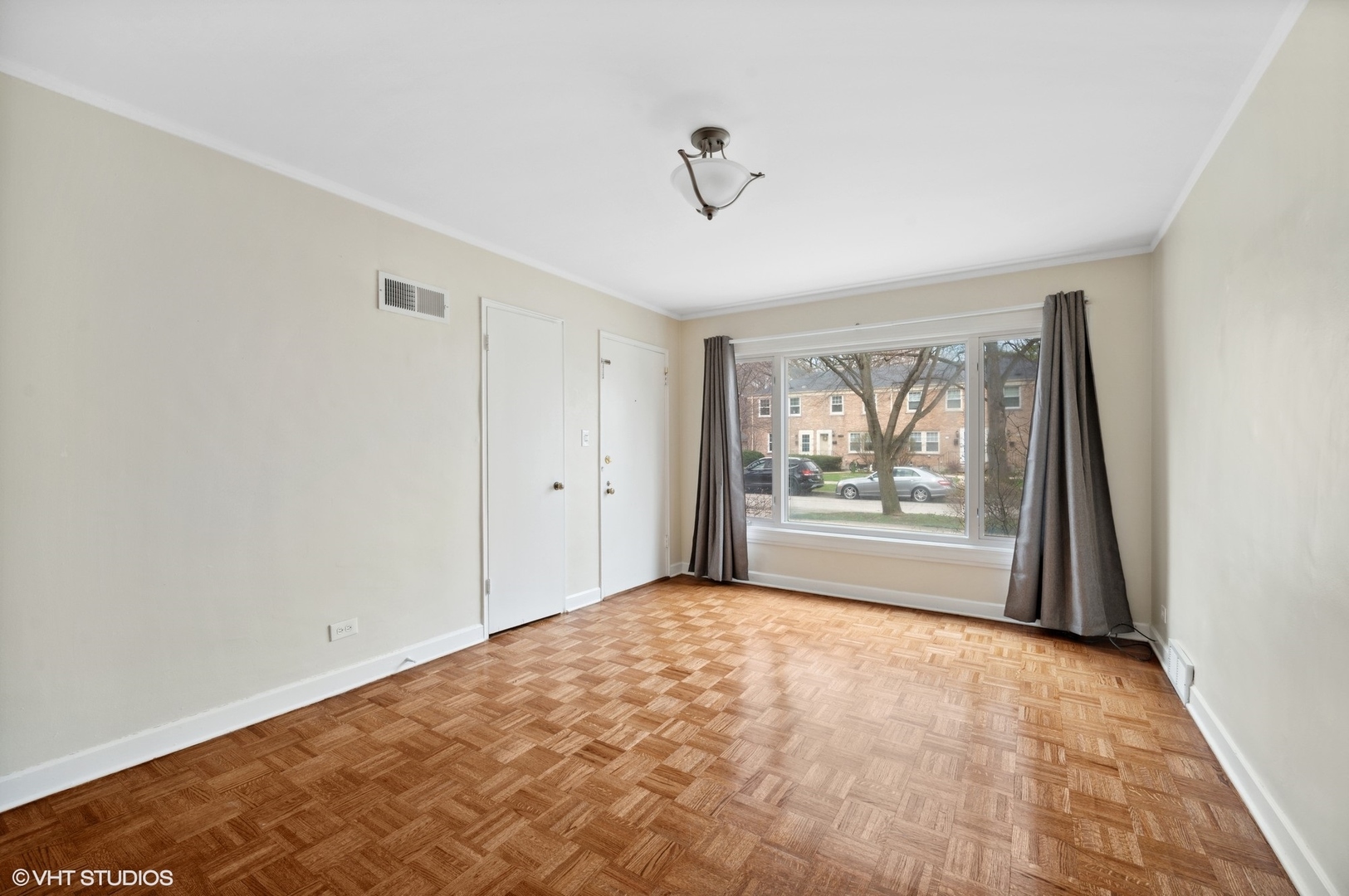 2311 Brown Avenue, Unit 1 Evanston, IL 60201 - Photo 9 of 13 a view of an empty room with a window