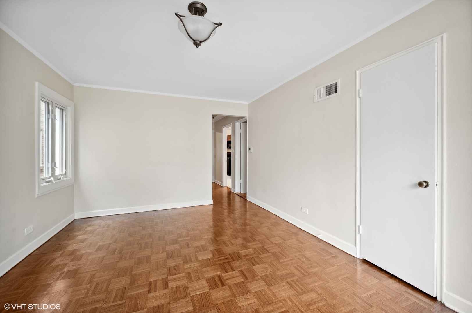2311 Brown Avenue, Unit 1 Evanston, IL 60201 - Photo 10 of 13 a view of an empty room with a window