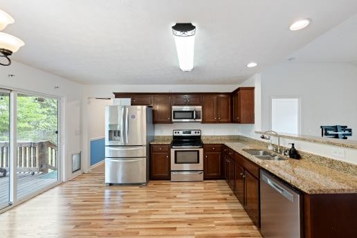 16 Andy Circle Lebanon, TN 37087 - Photo 8 of 25 a kitchen with stainless steel appliances granite countertop a sink and a stove