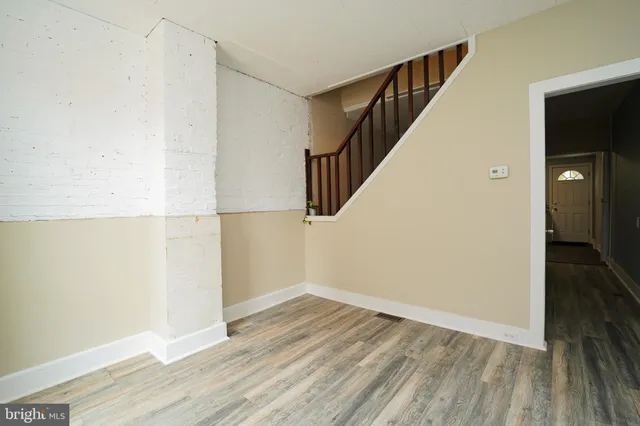 a view of hallway with wooden floor