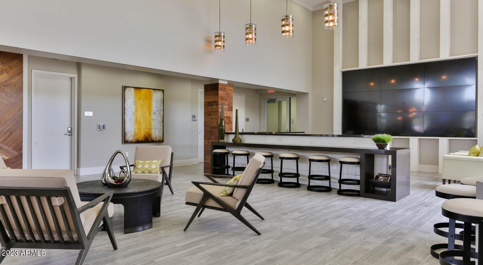200 East Thomas Road, Unit A1 Phoenix, AZ 85012 - Photo 16 of 26 a living room with furniture and a wooden floor