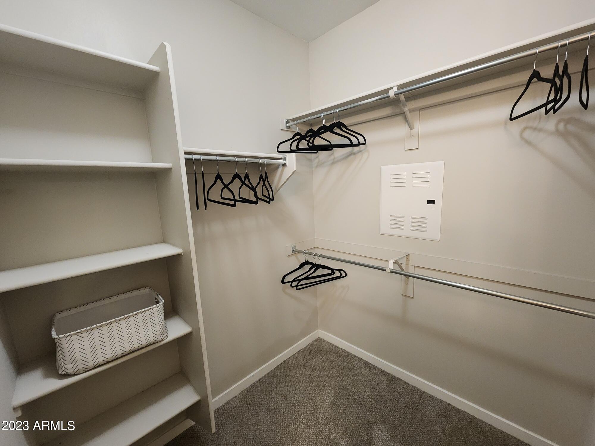 200 East Thomas Road, Unit A1 Phoenix, AZ 85012 - Photo 6 of 26 a view of walk in closet with clothes and shoes