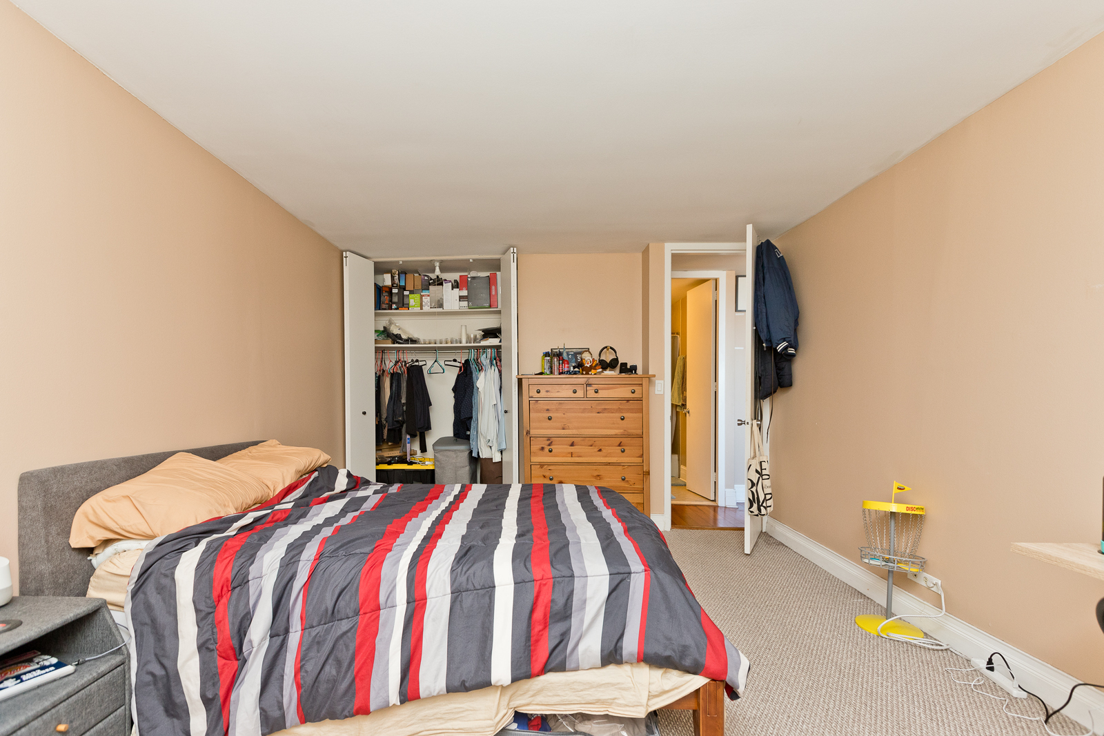 655 West Irving Park Road, Unit 2512 Chicago, IL 60613 - Photo 14 of 18 a bedroom with a bed and a chandelier