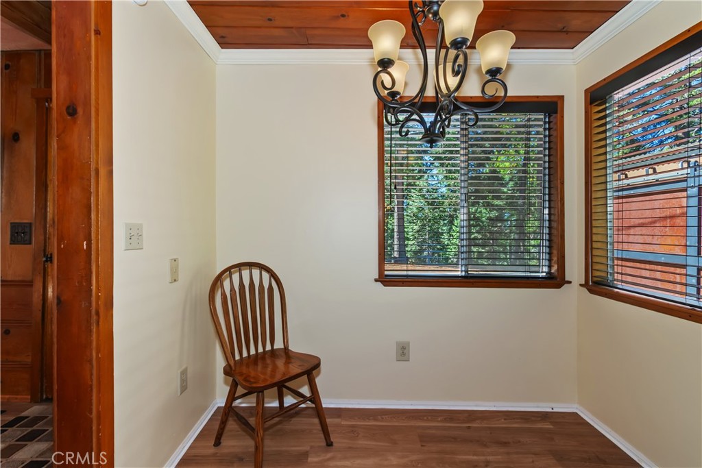 863 Oak Road Lake Arrowhead, CA 92385 - Photo 11 of 42 a view of a chair and table in a balcony