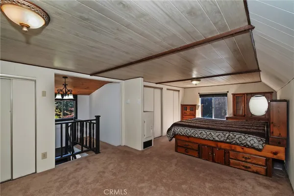 a very nice looking room with wooden walls and a window
