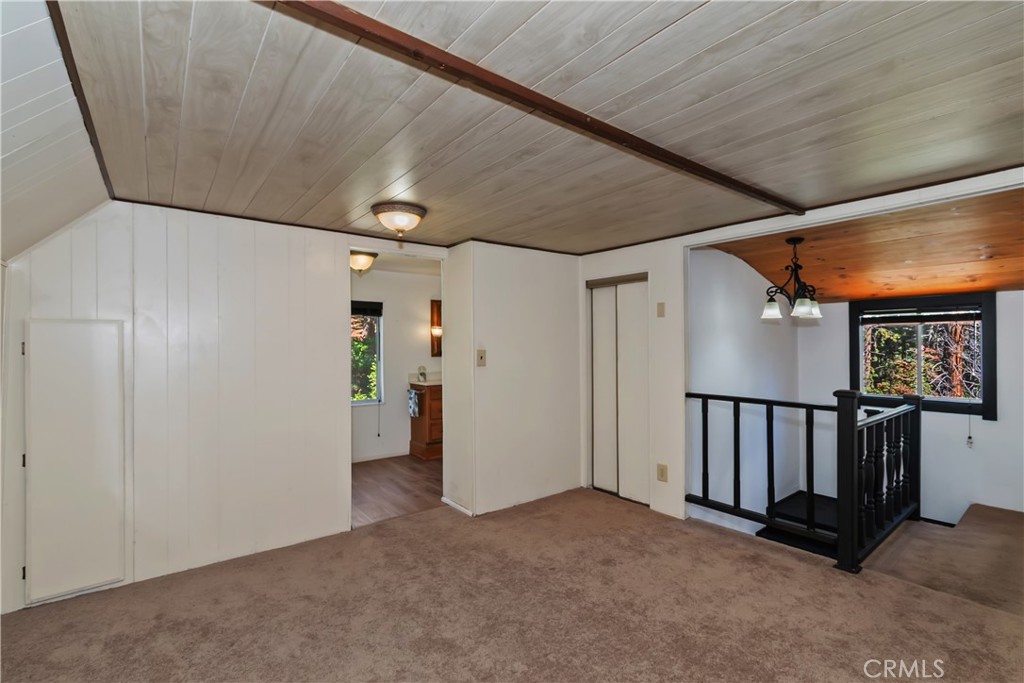863 Oak Road Lake Arrowhead, CA 92385 - Photo 25 of 42 a view of an empty room with window