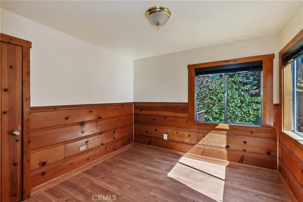 a bed room with a bed and a window