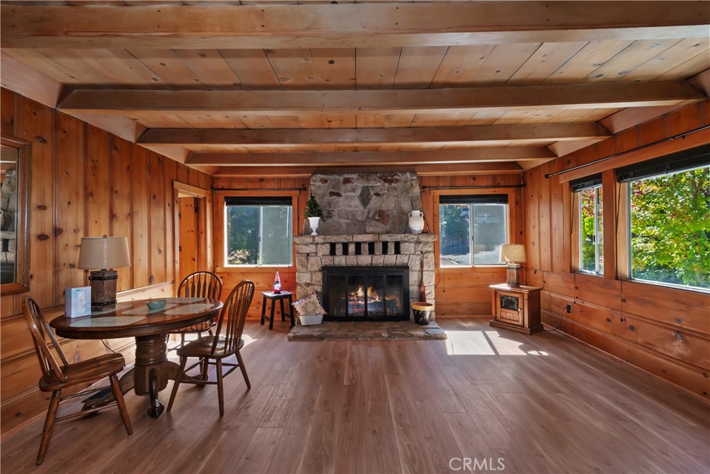 863 Oak Road Lake Arrowhead, CA 92385 - Photo 8 of 42 a view of a dining room with furniture window and wooden floor