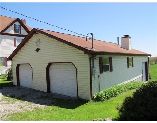 137 Harris Road Butler, PA 16002 - Photo 13 of 18 Parking Lot/Garage. Oversized three car garage with the RV camper entrance to the side