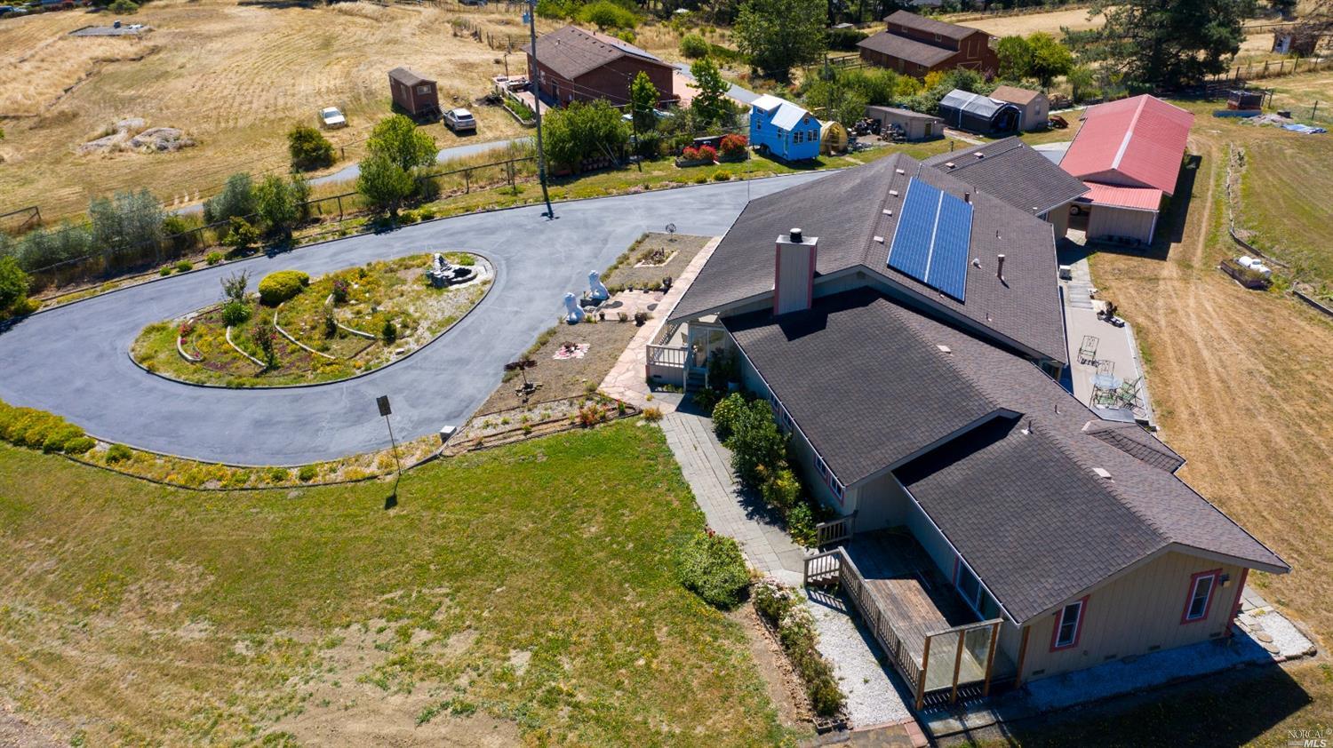 6700 Orchard Station Road Sebastopol, CA 95472 - Photo 1 of 1 an aerial view of a house with a swimming pool