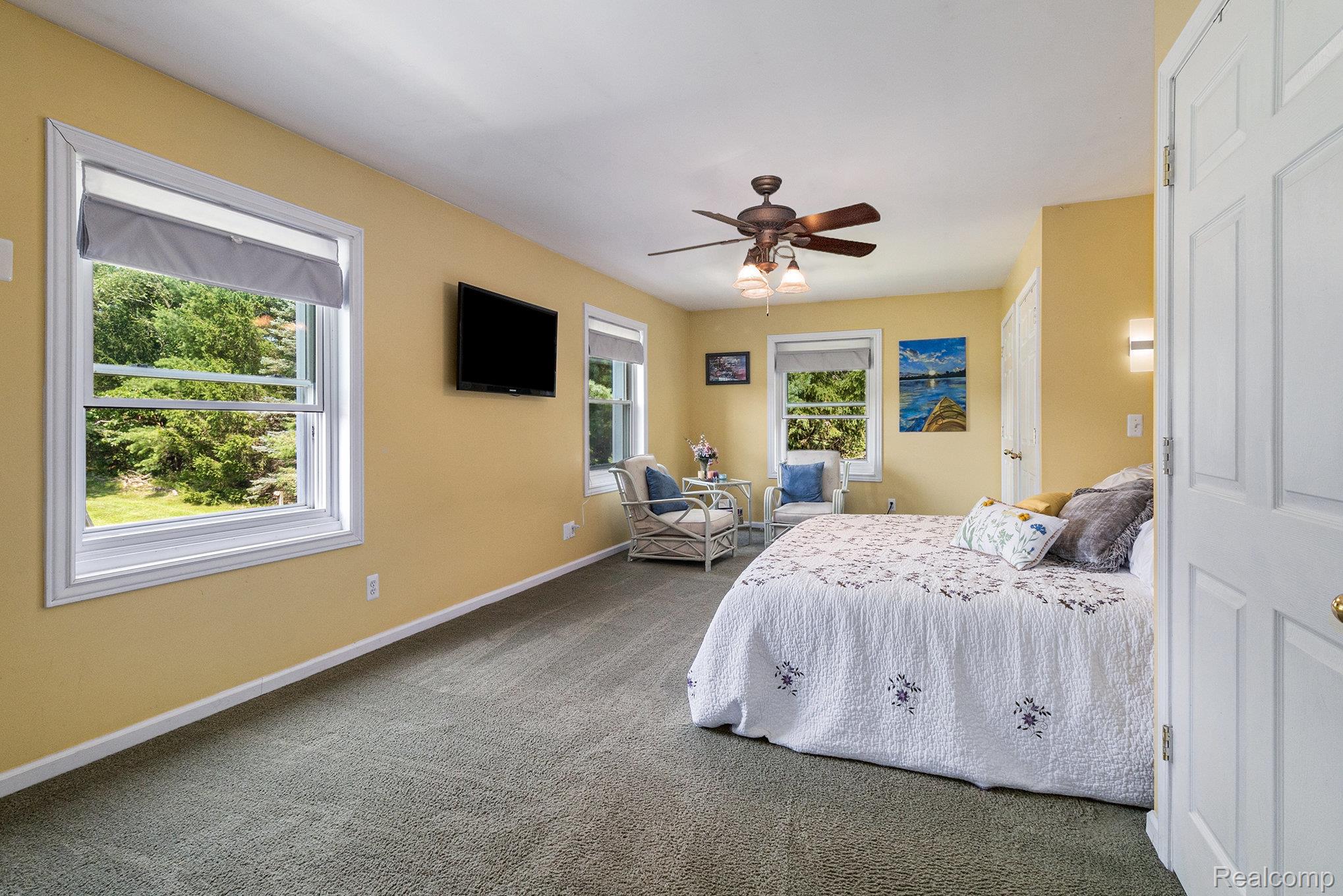 5083 Curtis Road Attica, MI 48412 - Photo 15 of 44 Bedroom featuring a ceiling fan and carpet flooring