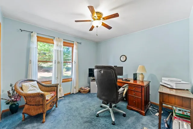 a workspace with furniture and a window