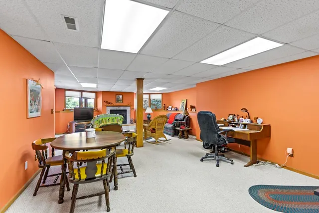 a view of a dining room with furniture and chandelier