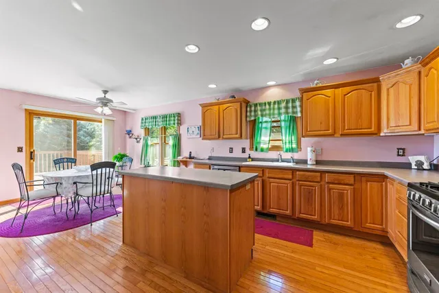 a kitchen with lots of counter top space and dining table
