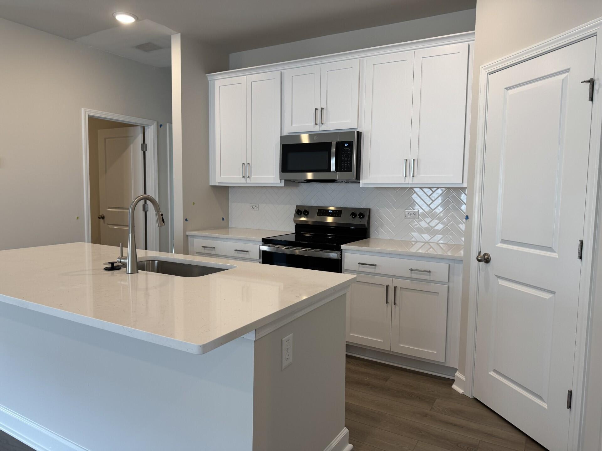 4012 Lemon Grass Lane Ravenel, SC 29470 - Photo 8 of 42 Lot 109 Kitchen and Island