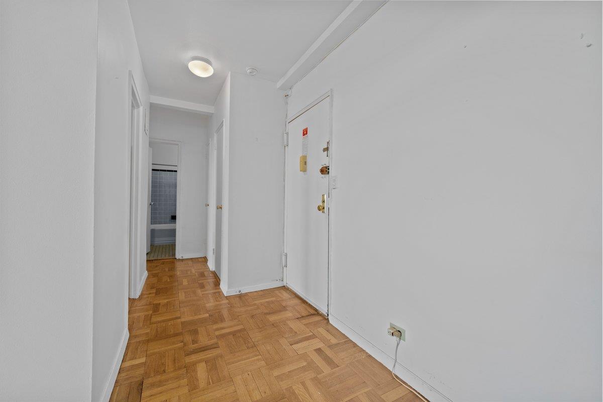 5500 Fieldston Road, Unit 8CC Bronx, NY 10471 - Photo 12 of 27 a view of a hallway with wooden floor and closet