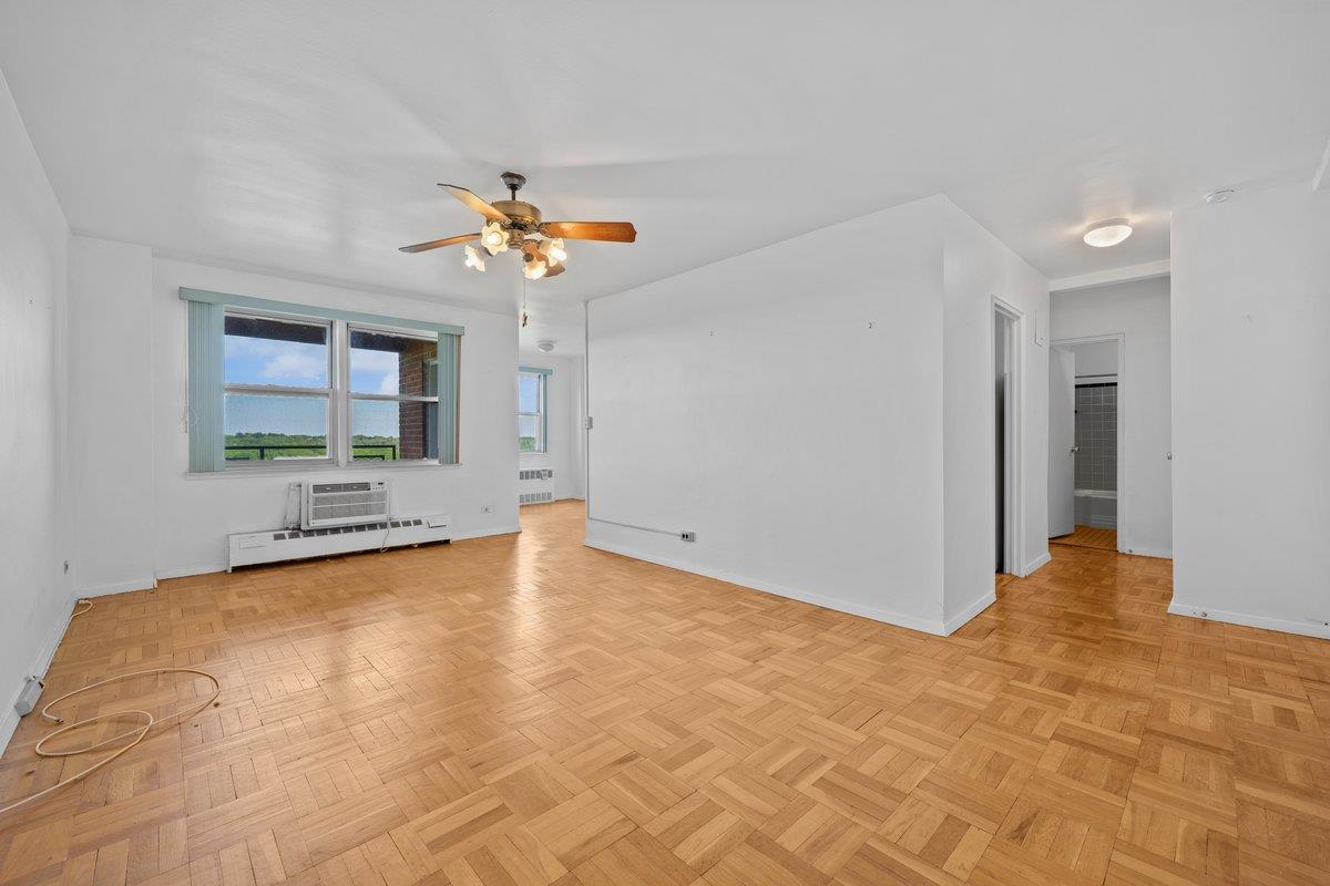 5500 Fieldston Road, Unit 8CC Bronx, NY 10471 - Photo 2 of 27 a view of a livingroom with a ceiling fan and window