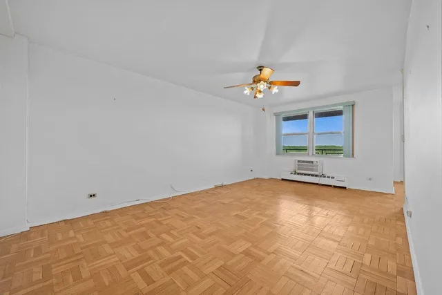 a view of an empty room with a window