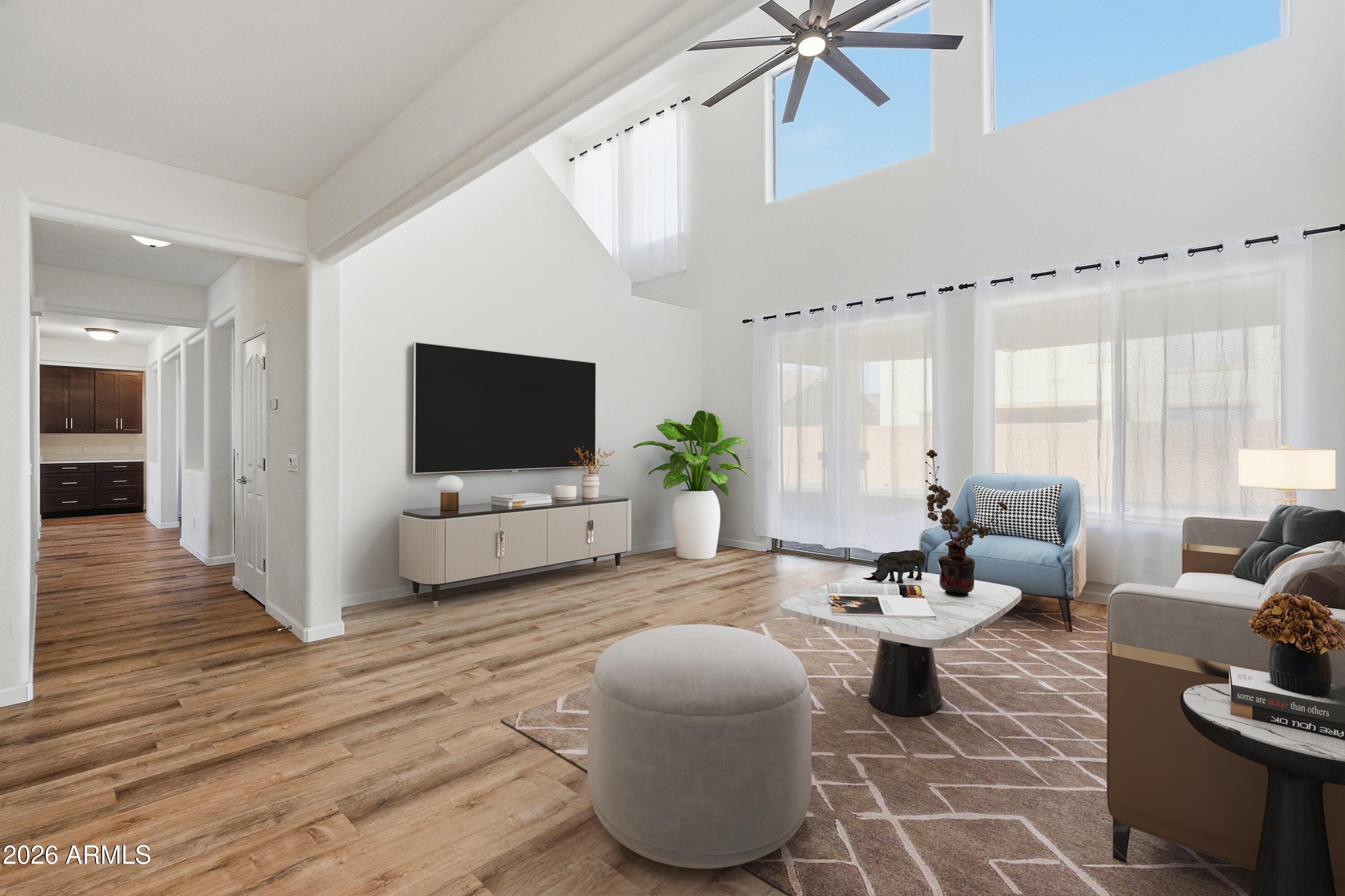 19760 East Mayberry Road Queen Creek, AZ 85142 - Photo 20 of 71 a living room with furniture and a flat screen tv