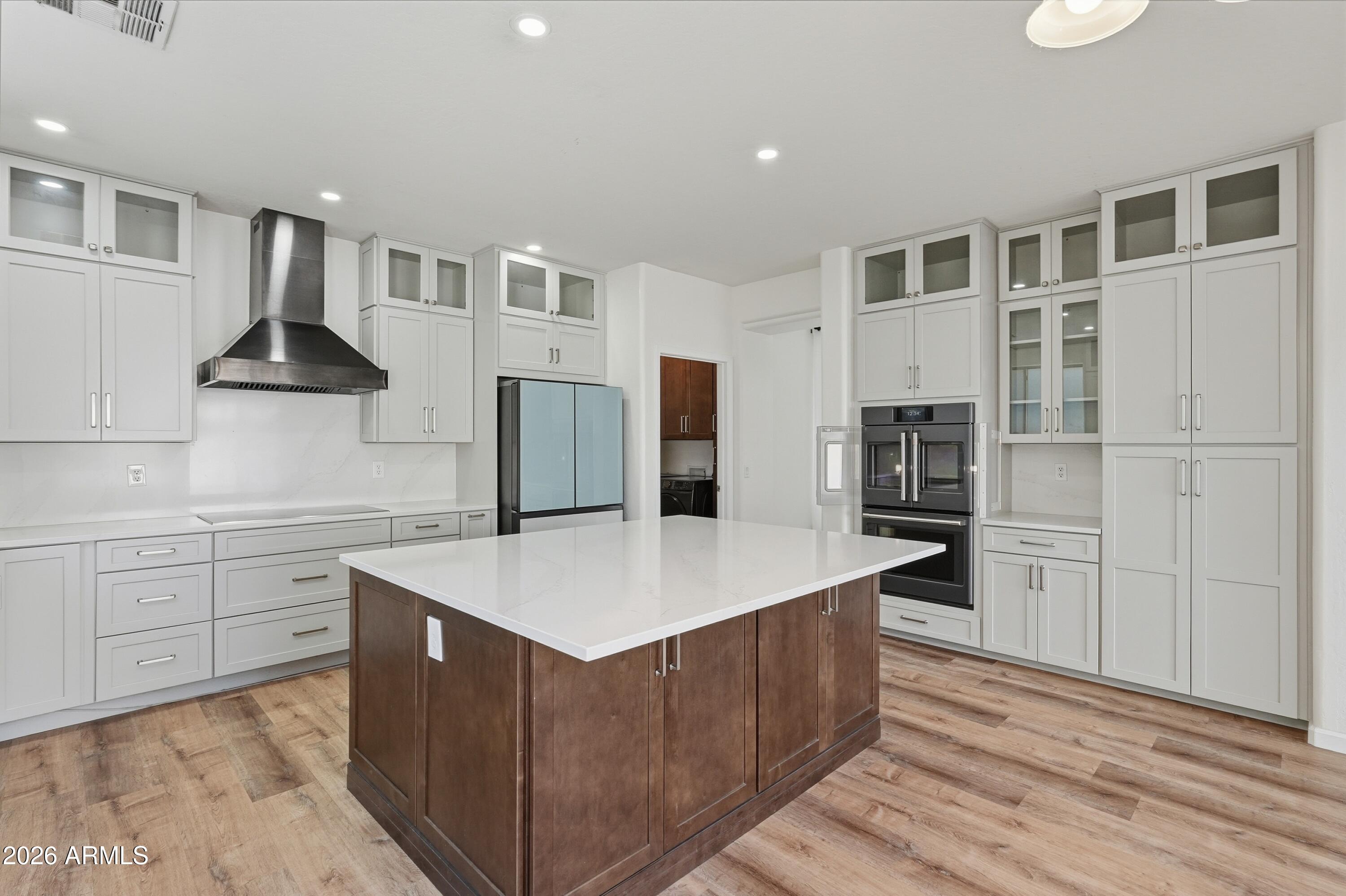 19760 East Mayberry Road Queen Creek, AZ 85142 - Photo 25 of 71 a kitchen with stainless steel appliances granite countertop a refrigerator a stove and a sink