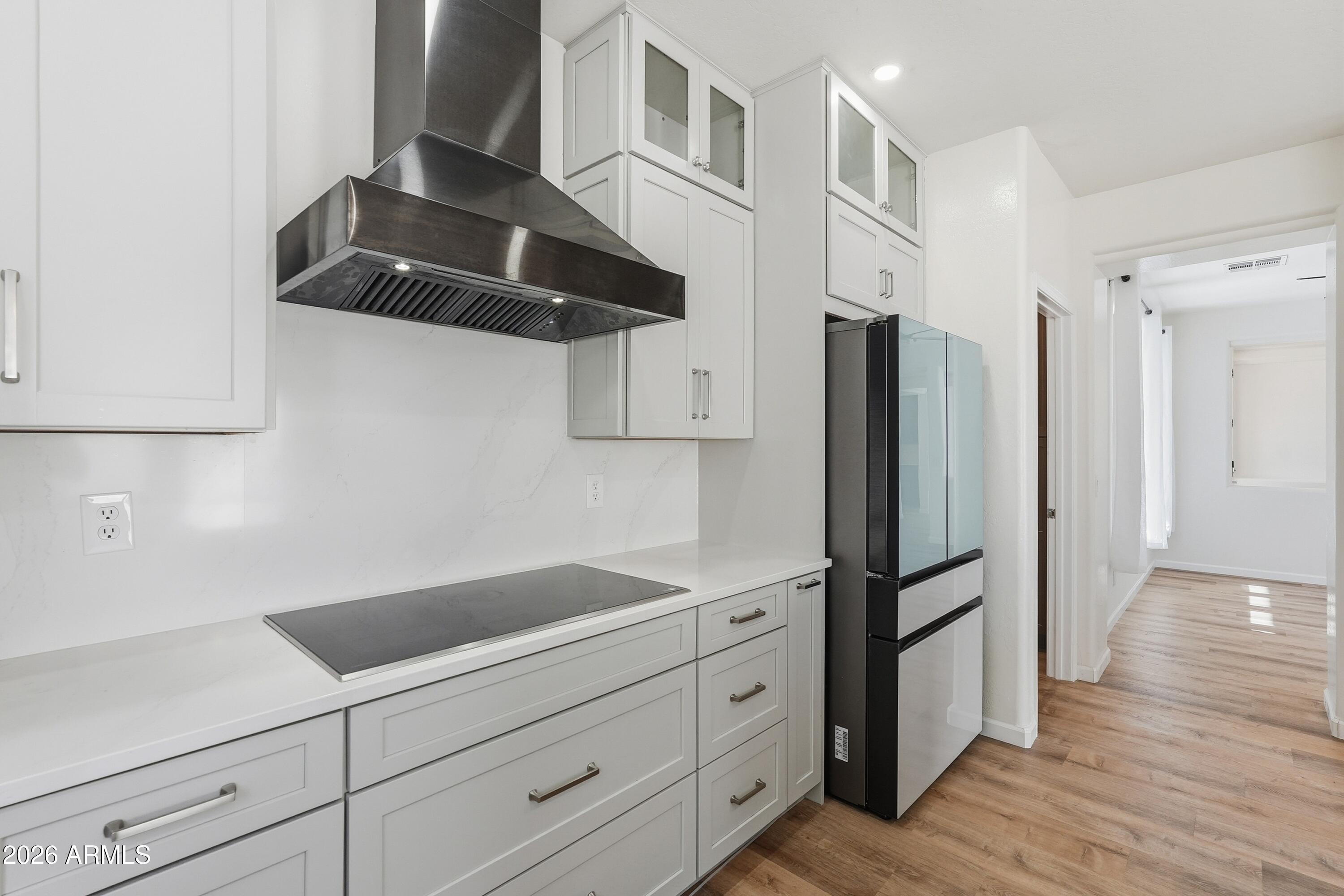 19760 East Mayberry Road Queen Creek, AZ 85142 - Photo 29 of 71 a kitchen with stainless steel appliances a refrigerator and cabinets