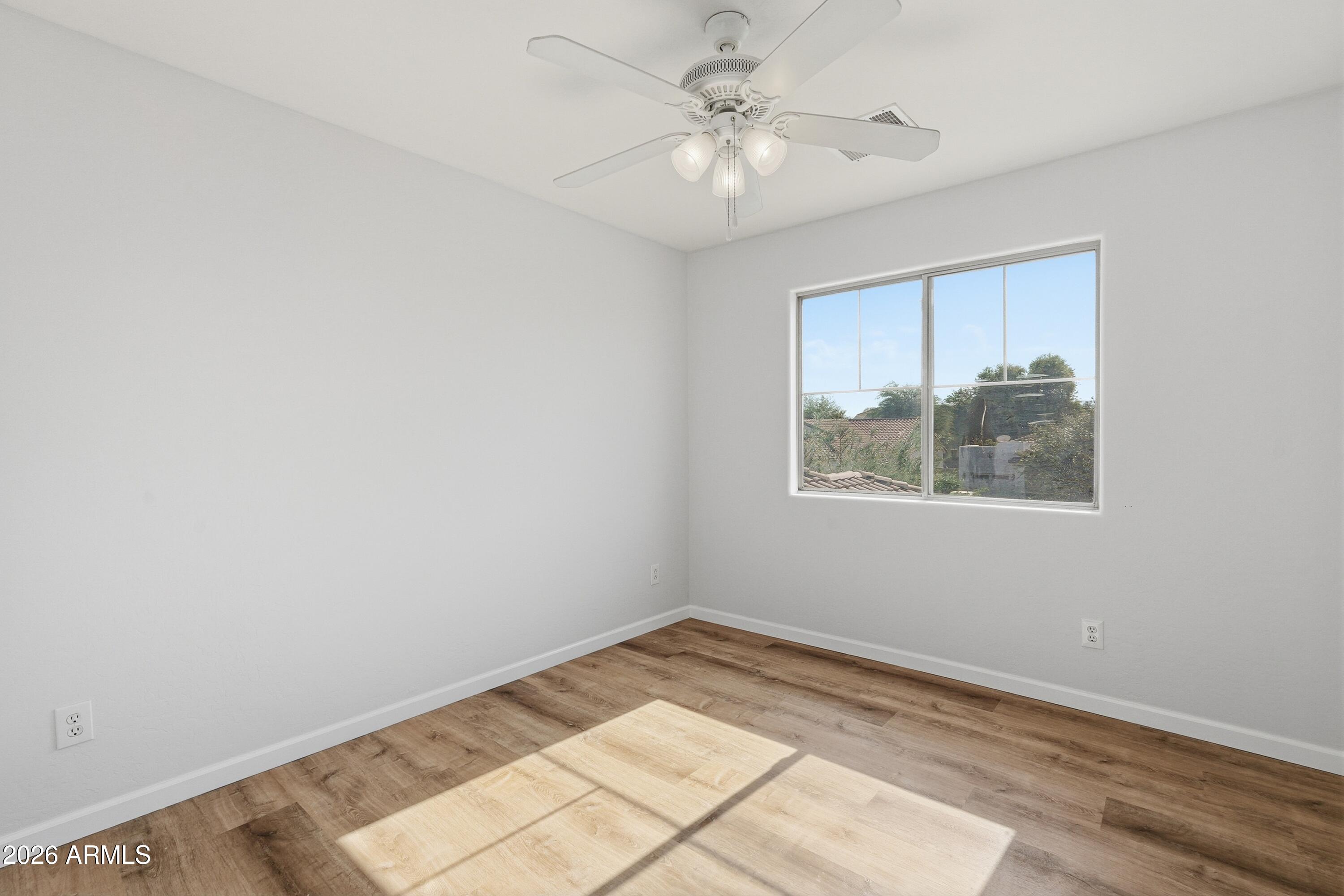 19760 East Mayberry Road Queen Creek, AZ 85142 - Photo 41 of 71 a view of an empty room with a window