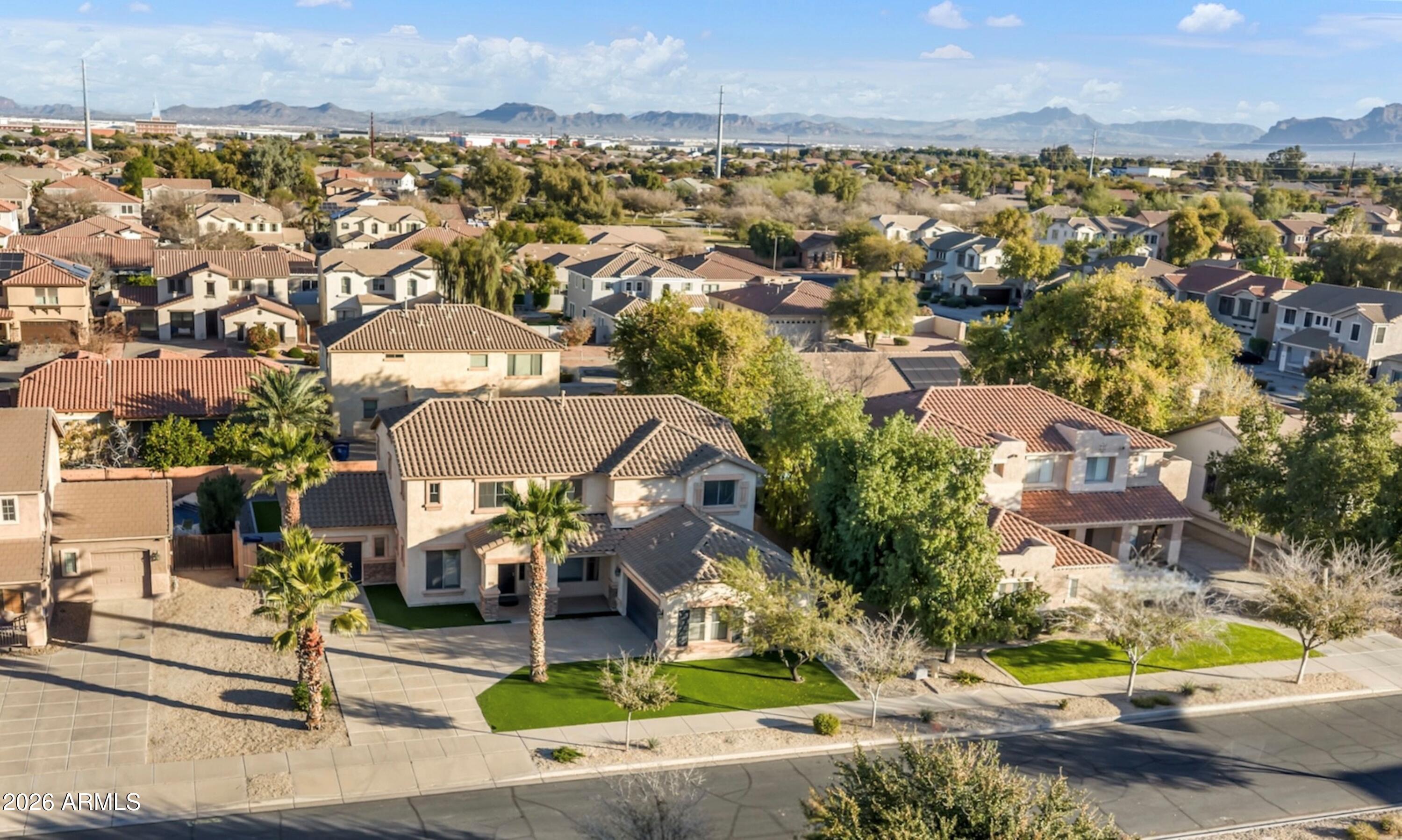 19760 East Mayberry Road Queen Creek, AZ 85142 - Photo 65 of 71 an aerial view of residential houses with outdoor space and parking