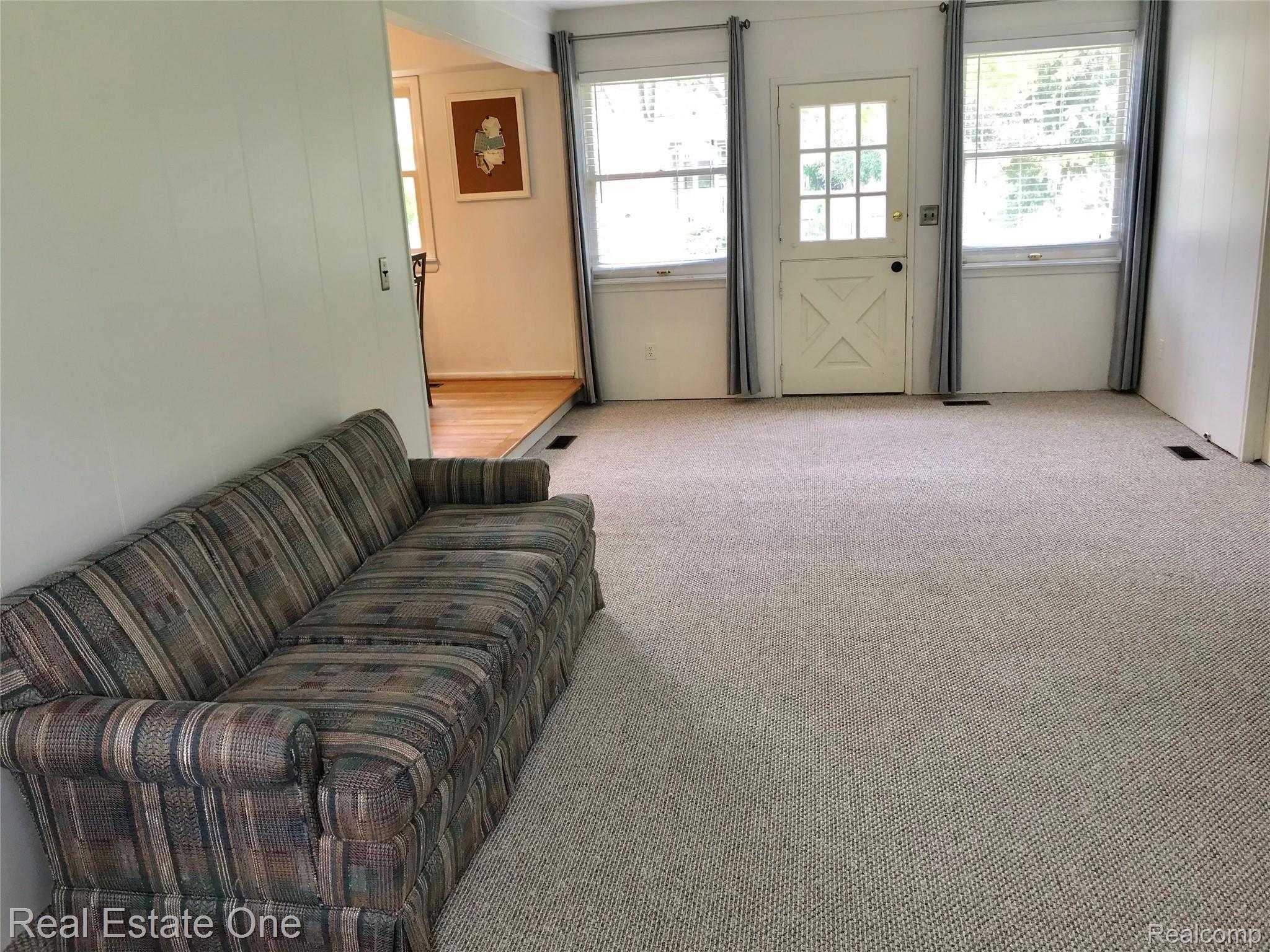 590 South Fieldstone Drive Rochester, MI 48309 - Photo 13 of 19 SPACIOUS FAMILY ROOM WITH NEW CARPET AND DOOR LEADING TO A PRIVATE FENCED YARD