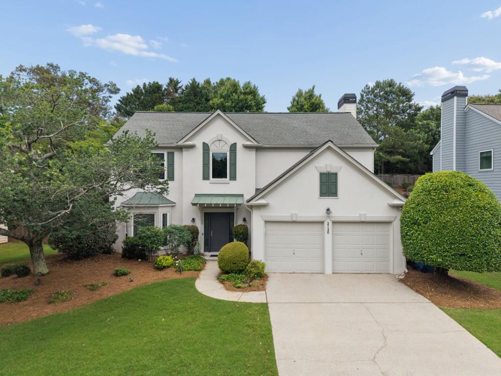 2120 Traywick Chase Alpharetta, GA 30004 - Photo 2 of 54 a view of a white house with a big yard and potted plants