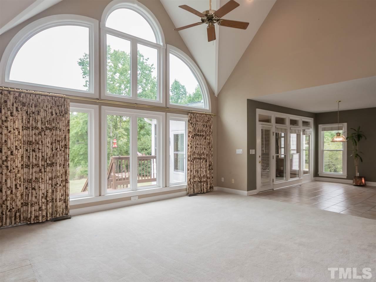 7717 Jenks Road Apex, NC 27523 - Photo 8 of 25 Two Story family room with Pond View