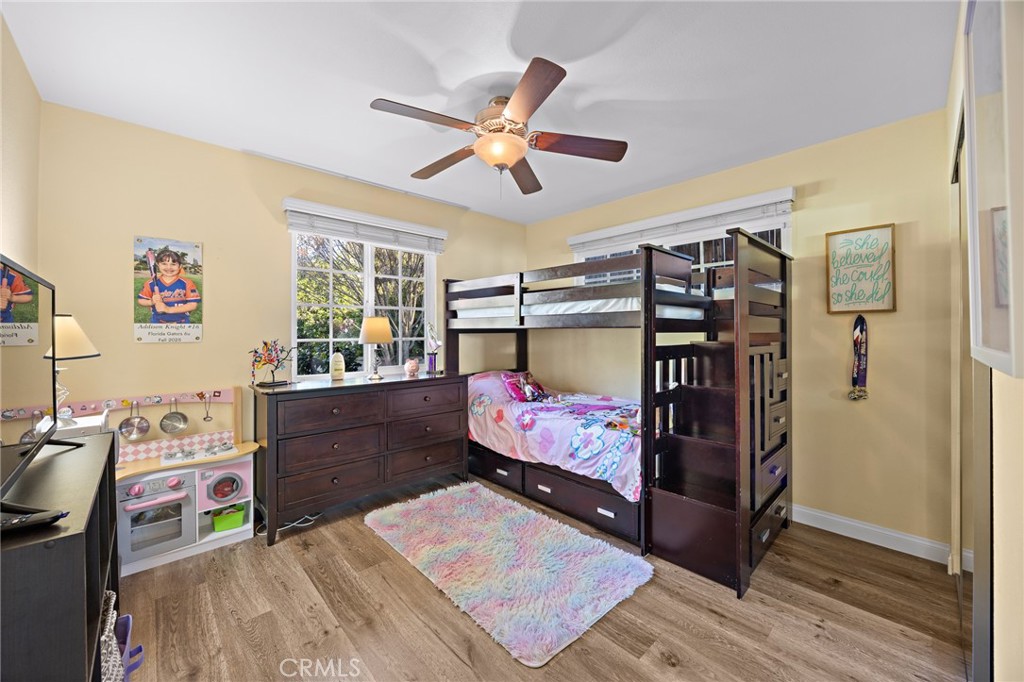 7548 Pepper Street Rancho Cucamonga, CA 91730 - Photo 16 of 24 a bedroom with a bed and wooden floor