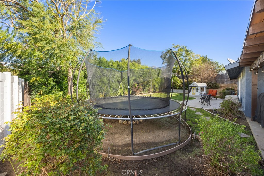 7548 Pepper Street Rancho Cucamonga, CA 91730 - Photo 20 of 24 a view of a fountain in the yard of a house