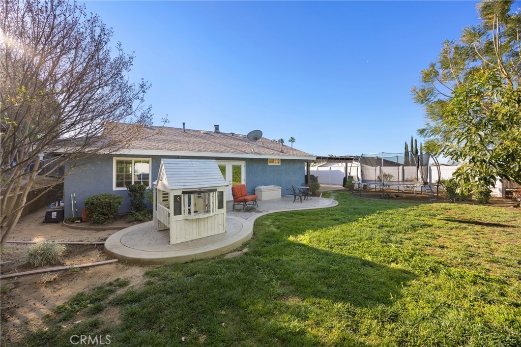 7548 Pepper Street Rancho Cucamonga, CA 91730 - Photo 22 of 24 a front view of a house with a garden and patio