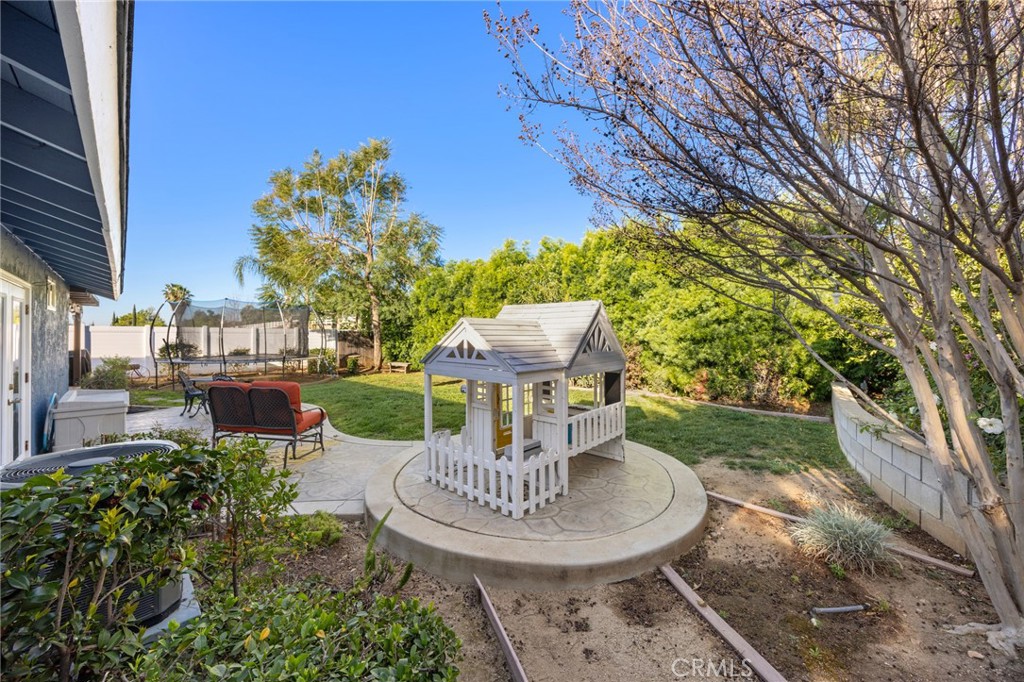 7548 Pepper Street Rancho Cucamonga, CA 91730 - Photo 23 of 24 a view of a table and chairs in patio with a barbeque