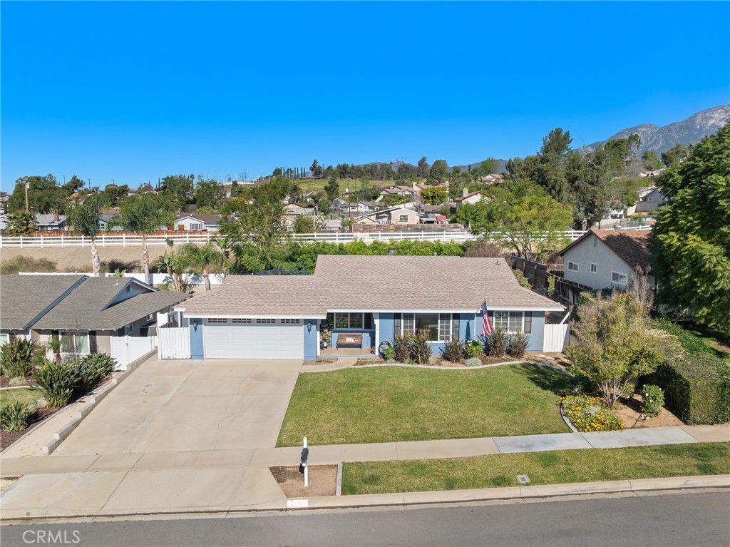7548 Pepper Street Rancho Cucamonga, CA 91730 - Photo 3 of 24 an aerial view of a residential apartment building with a yard