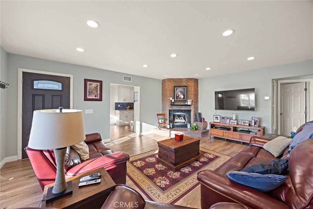 7548 Pepper Street Rancho Cucamonga, CA 91730 - Photo 6 of 24 a living room with furniture and a flat screen tv
