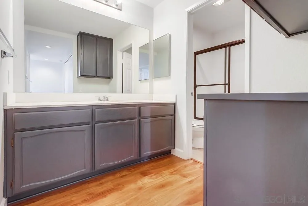 3525 Cameo Drive, Unit 92 Oceanside, CA 92056 - Photo 33 of 43 a bathroom with a sink and a mirror