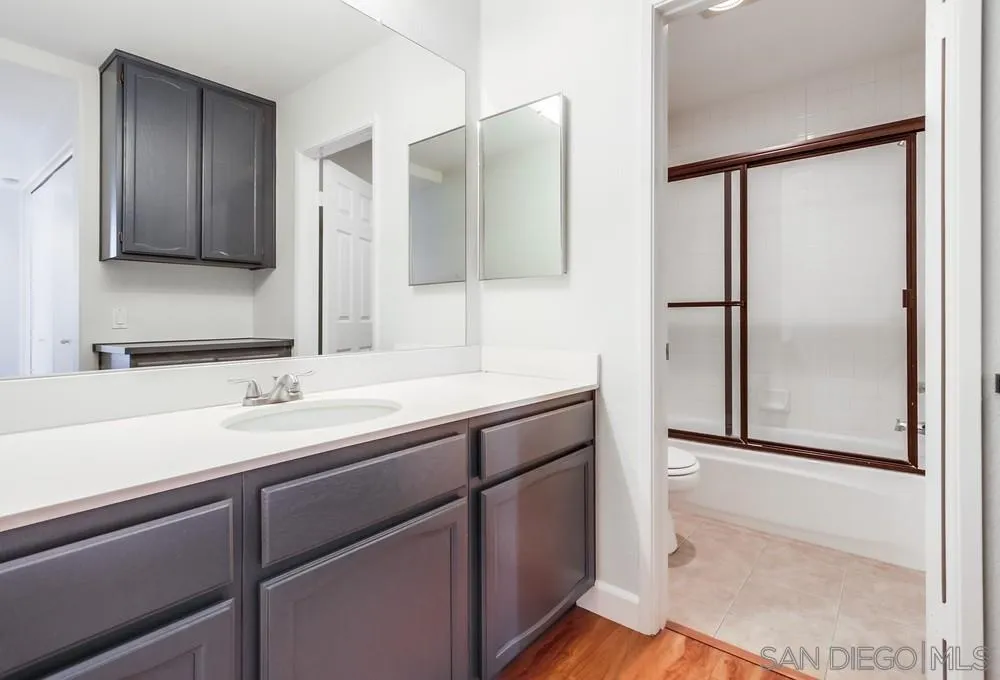 3525 Cameo Drive, Unit 92 Oceanside, CA 92056 - Photo 35 of 43 a bathroom with a double vanity sink and mirror