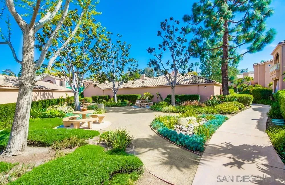 3525 Cameo Drive, Unit 92 Oceanside, CA 92056 - Photo 42 of 43 a view of a house with a yard and potted plants