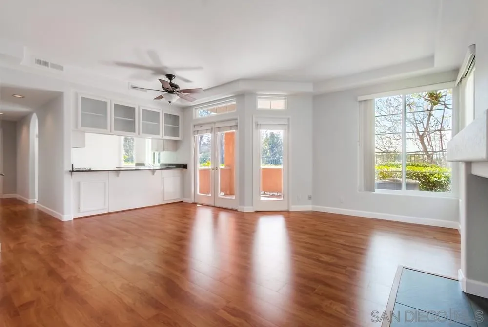 3525 Cameo Drive, Unit 92 Oceanside, CA 92056 - Photo 9 of 43 a view of an empty room with window and wooden floor